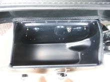 No lock hasp in the way.  Seems to be a little more storage, especialy because of the bump towards the rear adds more usable space.
