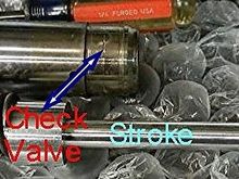 The check valve is located inside of the bottom of the fork.  Do not remove it, I am just showing what it looks like.  The top out spring is above & resting on the check valve and the shaft goes through the fork tube/check valve and the oil lock is installed on the end of the shaft.