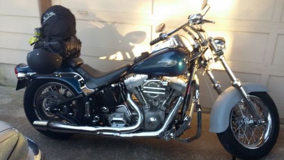 2000  FXST  Rear suspension lowered 1 1/2", 16" fat boy Aluminum Rims - Tires F & R   LePera seat,  Lowered Fat Boy F Fender (now painted matching Sinister Blue)  HD Drag Bars..  More, cant remember the names...