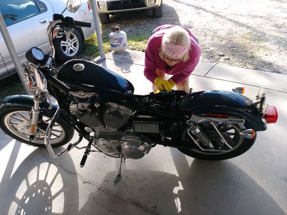 wife cleaning her sporty