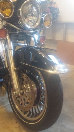Cleaned up the front fender by removing bumper and gawdy light and adding Road King fender badge. Added an HD eagle crest badge to the fairing too to find in a sea of black bikes. Also did my first 3 fluid change