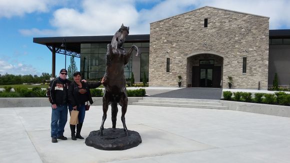 Suzie and I outside of the winery next to the dark horse for after which the winery is named.