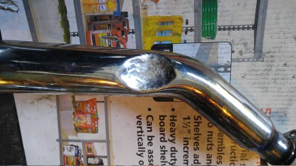 I had to dimple (well, I guess dent is more appropriate) the rear pipe to clear the throw-out lever.  And then some more, to clear the nut that holds the lever on the shaft.