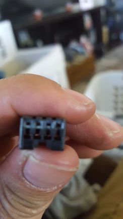 Oh and no writing on it at all. The end of it. 2 holes stacked on eachother. There is 4 slots for wire but this one omly has 3 wires in it