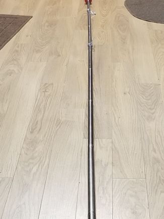 The pole is so long I couldn't get it all in the picture w/o going outside. It is 1/2 circumference at the top section