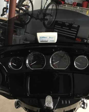 I just stick it on my windshield with the velcros they give you and have never had an issue.