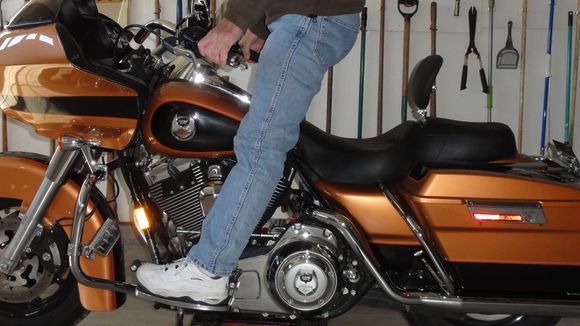 Both feet normal position on floorboards, really have to hold myself forward