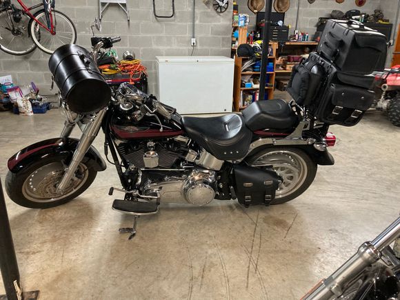 My wife and I have never traveled on a bike. Just ride around somewhat locally. I’d like to take a trip on it just to see how it works out.

Here’s what I’ve come up with so far for luggage. I don’t really like the bag on the handlebars. It usually rides behind the sissy bar and carries my wife a shirt, a few tools, and rain suits. It works great for that, and I hate to leave it behind. I think we can get everything else we’d want in the bags behind the sissy bar in the pic.
