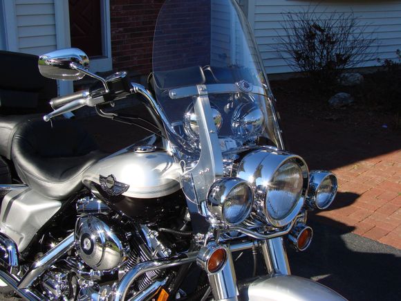 Mounted on the handlebars of a Road King.  Matches the spotlights