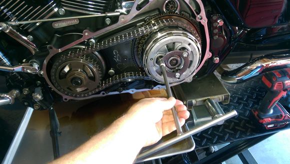 Loosen 3 screws each 1 to 2 turns at a time.  You want to remove pressure evenly.  If you don't you can break the bolt standoffs on the clutch hub. 