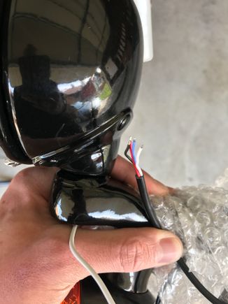 Here is what I'm working with. Black, Red, Blue, and White. There is also a white wire coming from the passing light but that's power for that light. The other four wires are coming from the turn signal. Both signals have the same four wires.