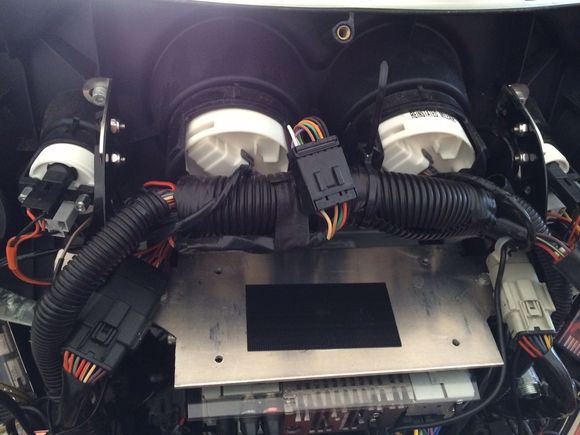 Here's pic of a custom cut plate I made to mount my Amps above HU to give some clearance.