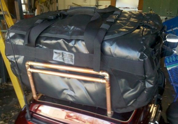 Sown with a different "waterproof" bag sitting on it before the straps were added.  That bag failed the water test miserably the first time we used it, so we sent it back.
