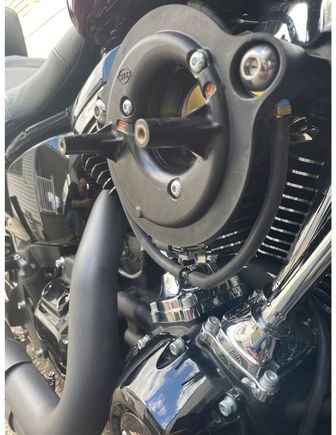 I did the same thing and plugged the holes with high temp silicone and vented with filter below the front tube.