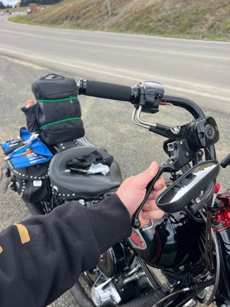 Ubiquitous Roadside Repair photo!
My brake light was sticking on, added tape to the brake lever prong that contacts the switch. FIXED!