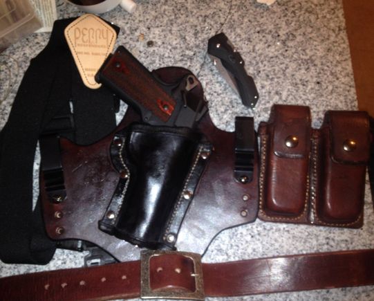 ISWB holster for my Colt 1911.  Also a case for some spare mags, very early project, didn't have tools to do a proper stitching line when I made it.  A belt I made that I'm going to have to punch more holes for as I'm on the last one now.  May be time to make a smaller one.
