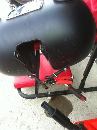 Gas tank removed. I used hemostats and vise grips to clamp off crossover fuel line to remove from frame.