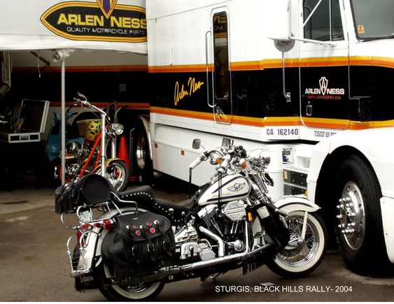 Sturgis 2004- Sweet Freedom parked at the Arlen Ness booth where I has a Ness triple-tree adapter installed. Like everything else 'except FLSTS', the un-standard tree of of the FLSTS will not accept many add-on devices, without such an adapter (only made by Ne$$), which I needed for my new instrument cluster.