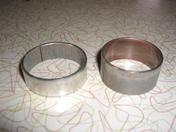 Left side fork bushings from my Wide Glide...2 seasons old.