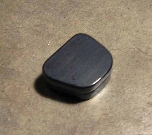 Grommet plug made from JB Weld.  Info here: http://www.hdforums.com/forum/dyna-glide-models/165942-cleaning-up-the-wire-harness.html