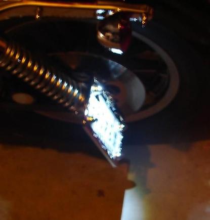 I made the side plate mount awhile ago, I put a high out put LED spot light in the rear directional to light it.