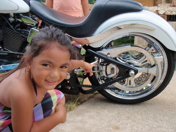 My Lovely Assistant, Mele. Pointing out the Rear Brake Assembly.