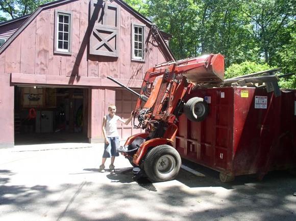 my son who drove the tractor up the side of the dumpster