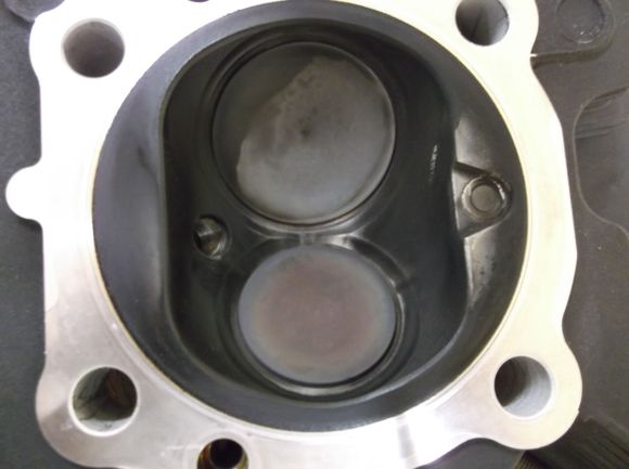 I'm not trying to lower compression, my compression is 198 on both cylinders with -7.2cc pistons and the 54's. The cylinders were decked .014" for 0.00" piston height and a .030" gasket installed.

No, I didn't make any mistakes, those numbers are 100% correct.



The bike will start up and run quiet, after about 1 mile I get what sounds like valve noise (been chasing that for a few months). The noise happens at 1850 rpm and is gone at 2200, it comes back at about 2400.

IT IS NOT ROCKER SHAFTS 