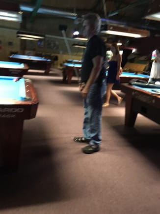 My buddy Doug shooting pool. Oh yeah, and that girl looked better walking away! Missed that pic.