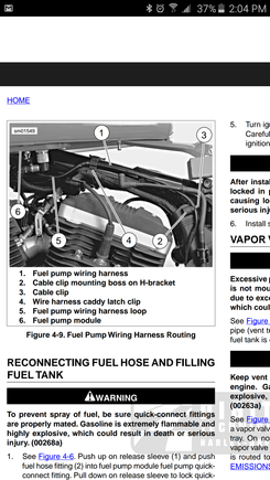 Shot of the service manual showing a block of wood for a prop.