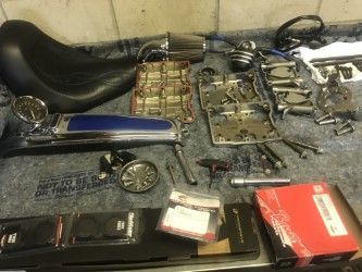 I MEAN the guys great, all my stuff laid out, today someone, was HAND CLEANING all the oil etc, off parts, and putting light coat of oil on, and preserving till build comes in!!!, and YES those are some parts in front, all parts in photos are for this bike, this area is the Rocker C Build...lol