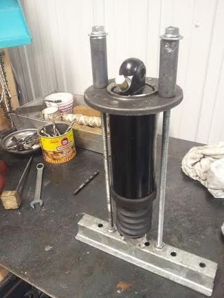 I just crank her down, grab the whole set up and dump in a bucket. Set it back up on the bench and just add oil in the open area. 10 minutes done. Pump the rod a few times to bleed and let sit a few minutes for air to escape if any.