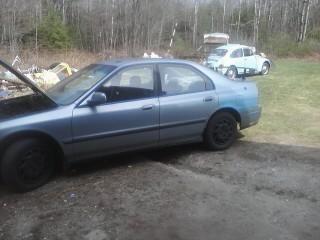 This is how it looked when we got it. All that we did to it at that point was paint the rims black and add on a fabricated spoiler.