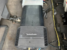 Underneath rear seat