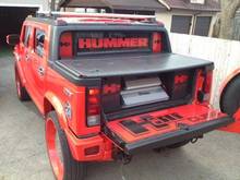 Hummer H2 Sut sittin on 30's with custom system