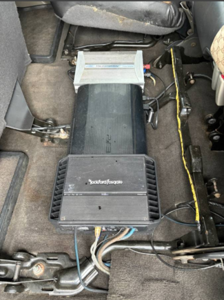 Underneath rear seat