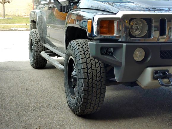 Pokes out about 2.5"  No rubbing or scrubbing