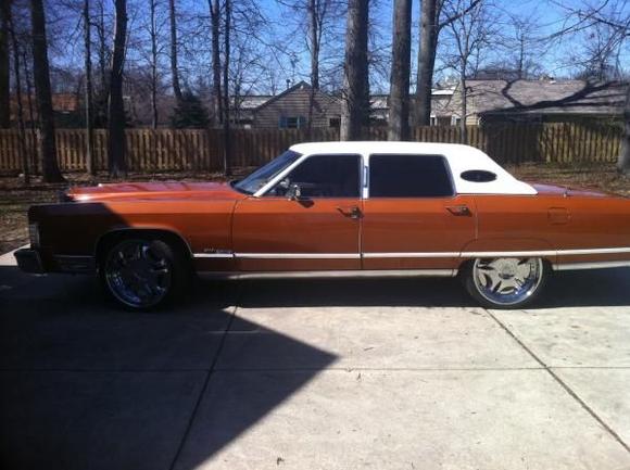 77 Lincoln Continental Town Car on 23" Helo wheels w/ Nitto Tires

Inside currently torn apart and stripped down, redo-ing the whole interior. Used to have a fish tank in the back, TV's in the doors, custom fiberglasses trunk, etc.