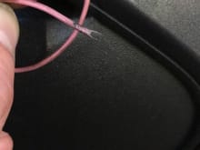 Close up of unknown singular pink wire