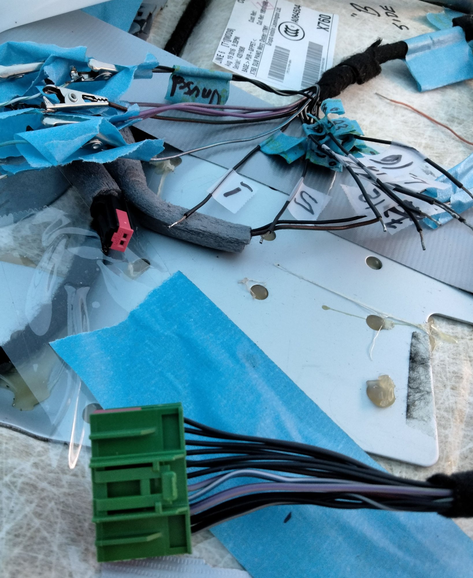 The green block is the female connector running down to the other half in the passenger pillar. 