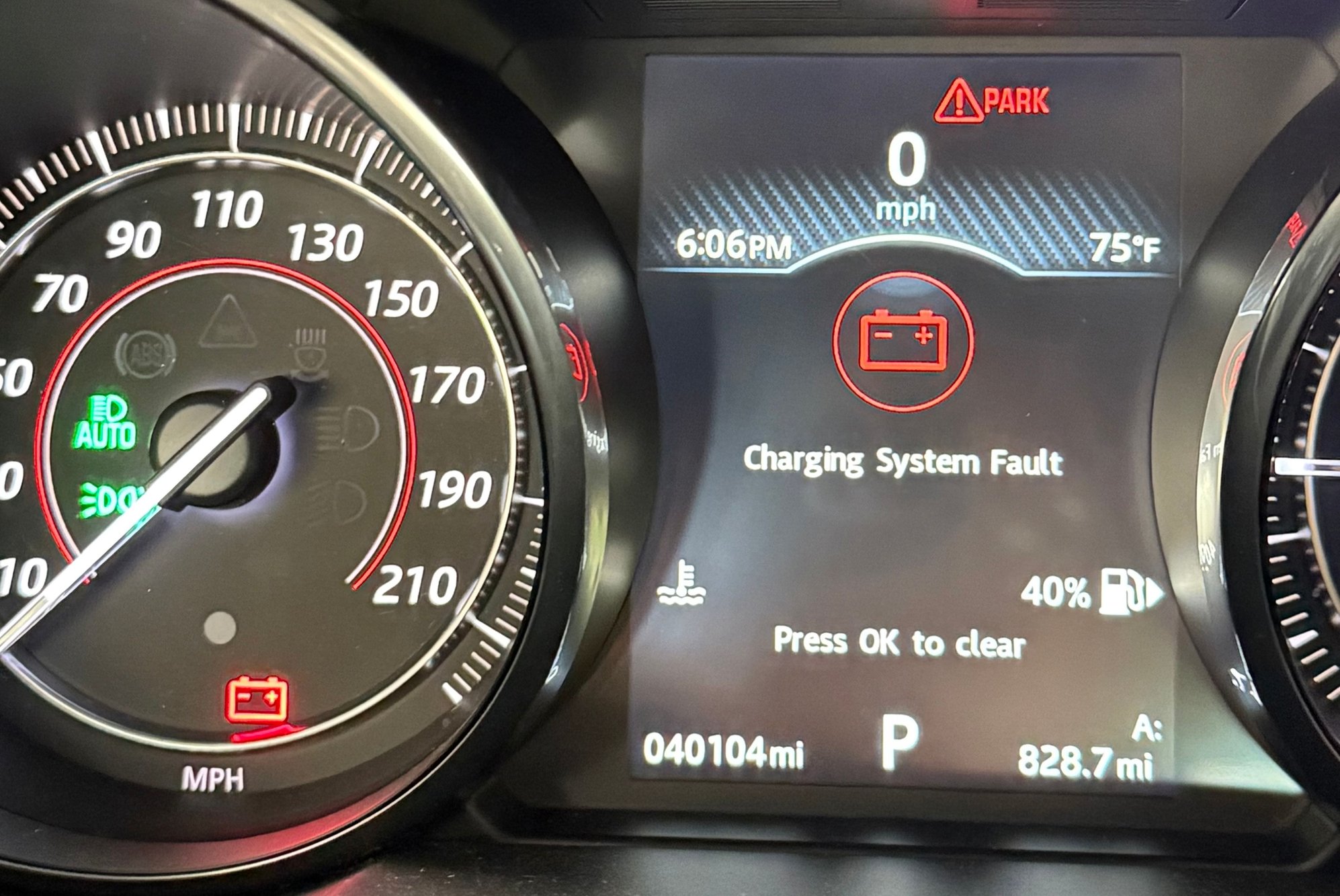 Large charging system fault, symbol, and words disappear when hitting menu, but others remain.