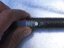 I filed a flat so I could center punch for the drilled hole. I drilled 1/64" under, then 1/4" finished size and had a nice tight slip fit.