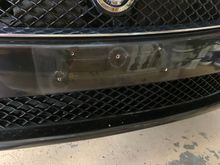All the holes in the front bumper from the bracket - and too-long plate screws