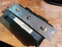 Driver's side SCM with lid repaired and mounted to bracket. Seam is taped--not for attachment but for moisture-proofing.