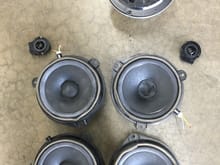 Here are the stock pioneer speakers. 4 paper 6.5" door speakers 2 1" tweeters and 1 6.5" subwoofer. There was also a 4" round center dash speaker that was especially brittle. I punched my finger through the paper without much pressure. In all the speaker swaps ive done ive never seen a plastic subwoofer which is what the stock one was made of.