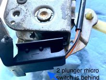 2 plunger microswitch is behind this cover.