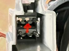 There are small grey plastic tabs that are part of the connector that have to be gentle released before you can pull out the pins. You need to remove the ones shown , one for each voice coil of the subwoofer. 