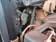 Right rear quarter window regulator and motor that was removed to gain access to route the harness ro remove the harness into the trunk.