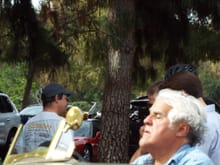 Jay Leno pulling in with his crazy cigar shaped Fiat
