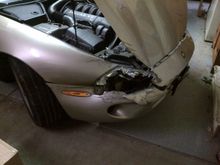 Surprisingly the fog light is still hanging by it's wires  inside the fender. I JUST replaced that headlight a few months ago too.